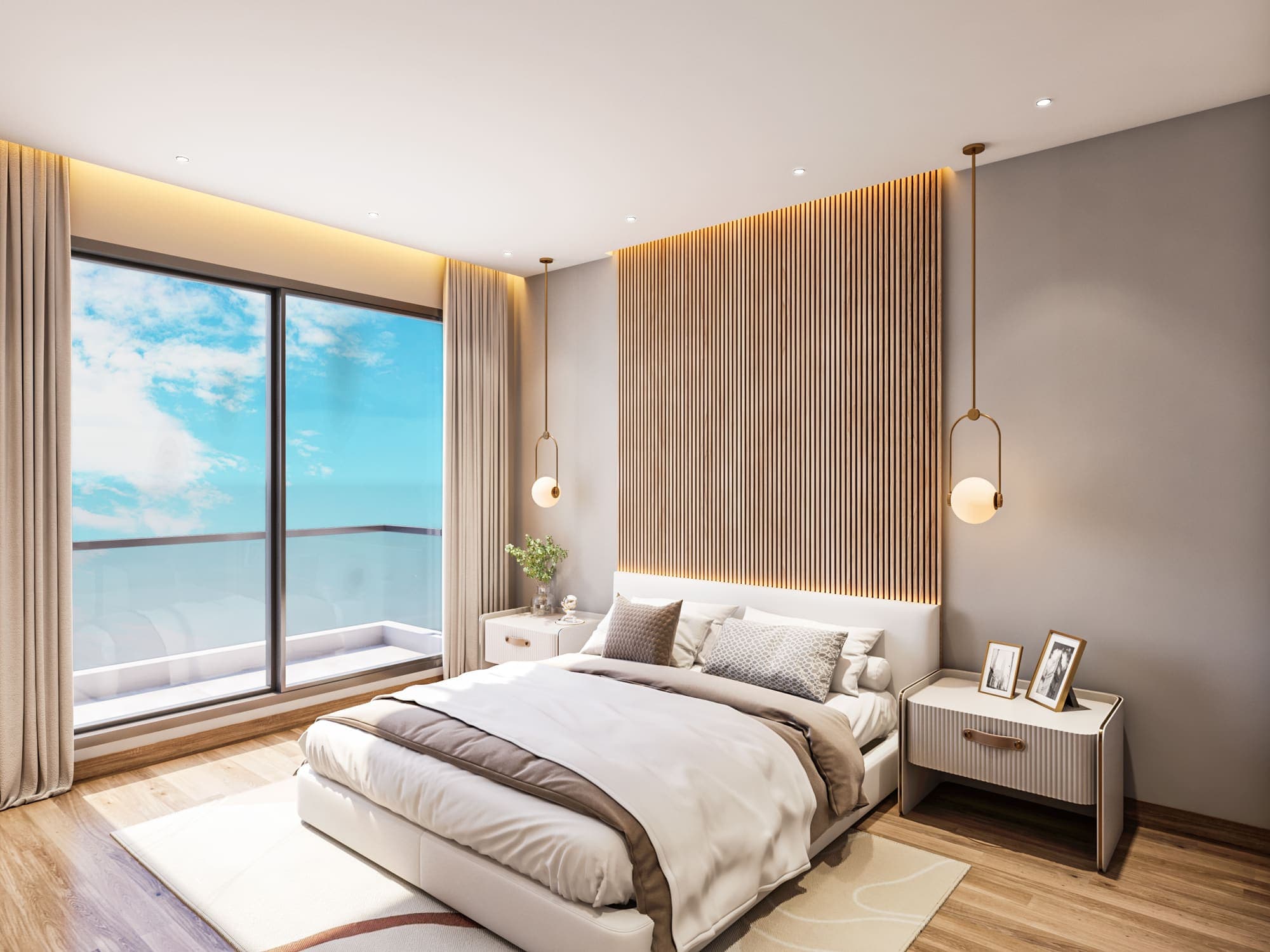 Bedroom opening onto a balcony through a wide sliding window