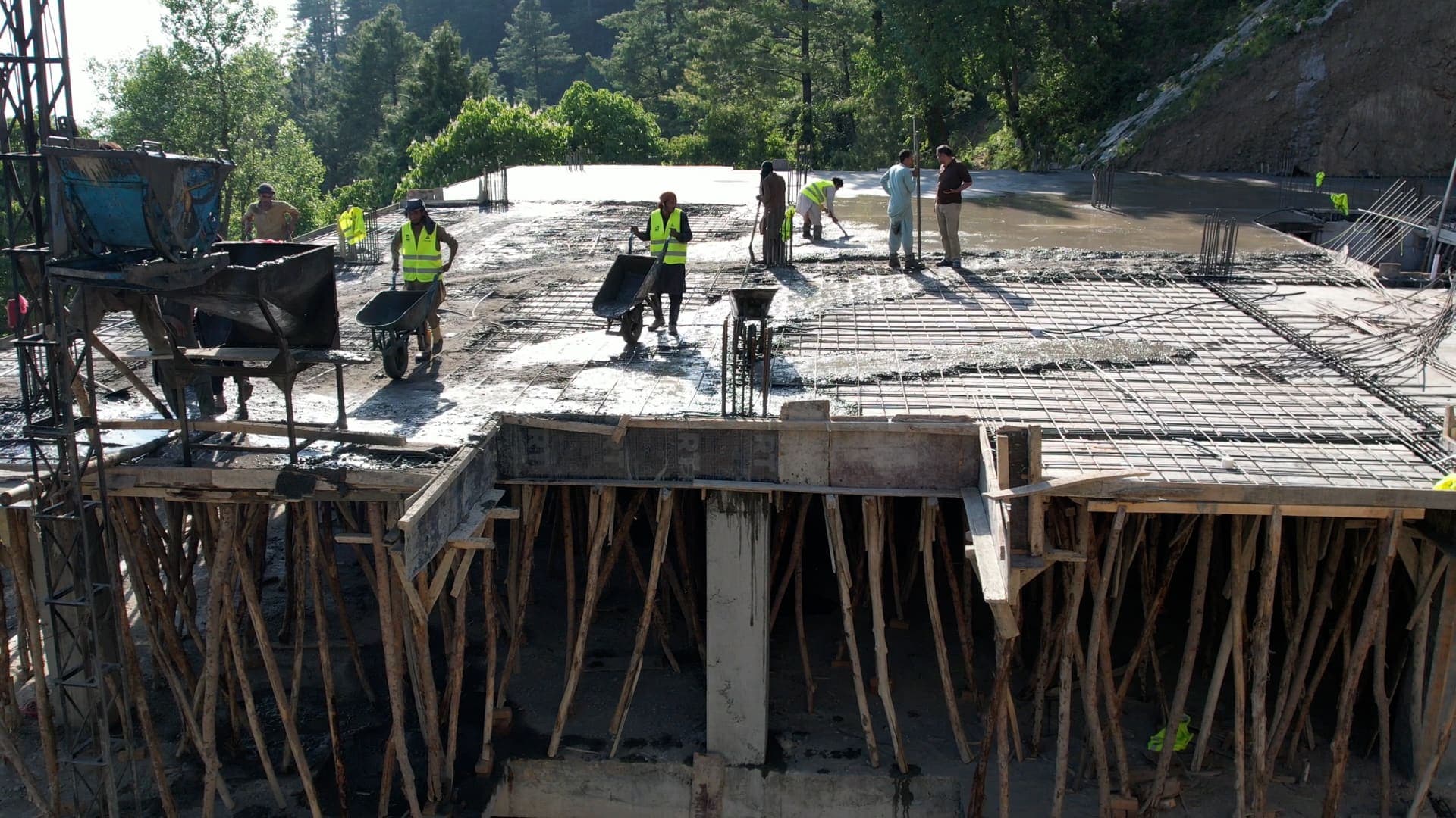 Workers casting a concrete floor slab on site at Skyline Terrace